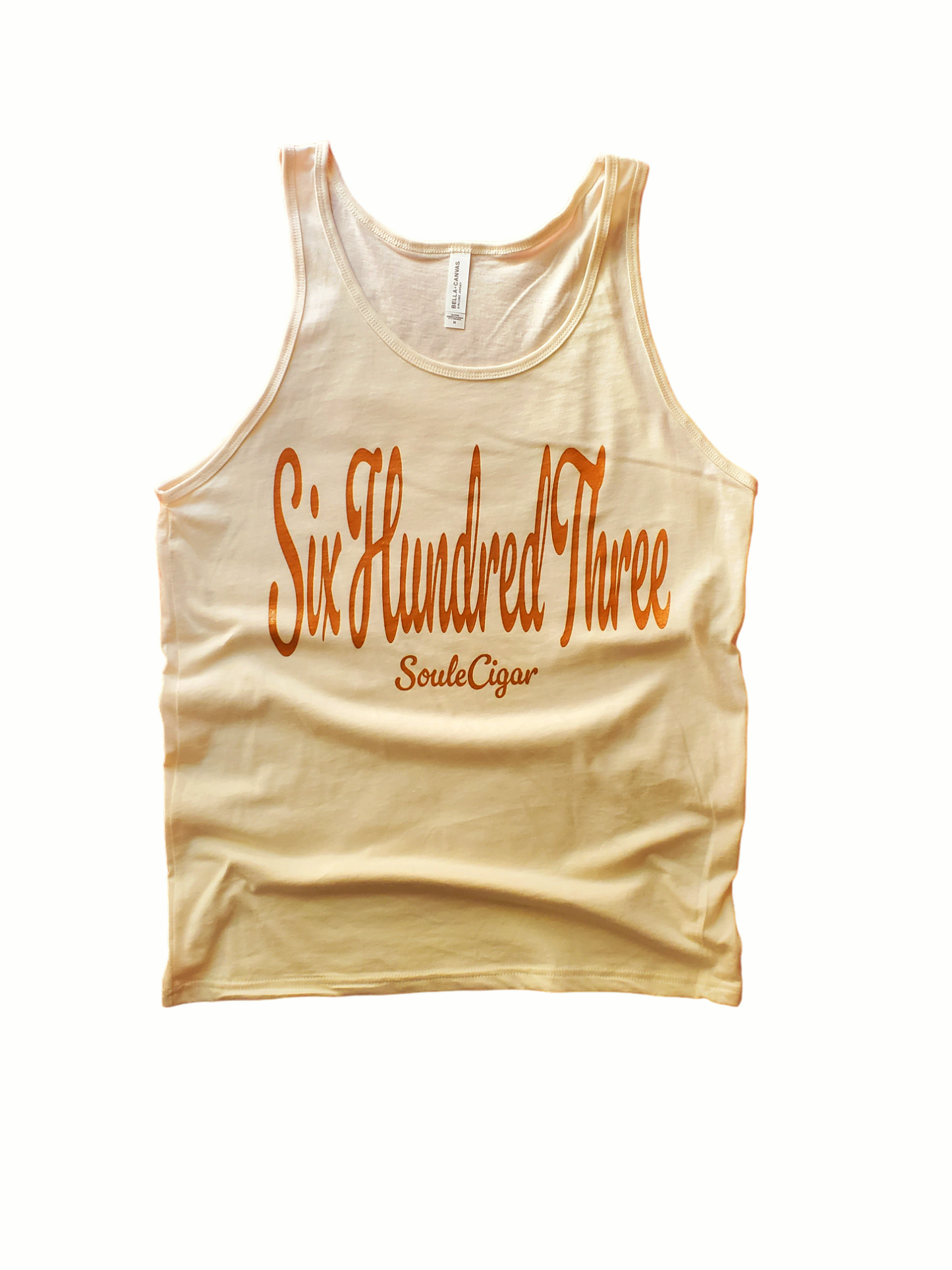 A beige tank top with 'Six Hundred Three' and other text printed in Light Brown on the front.